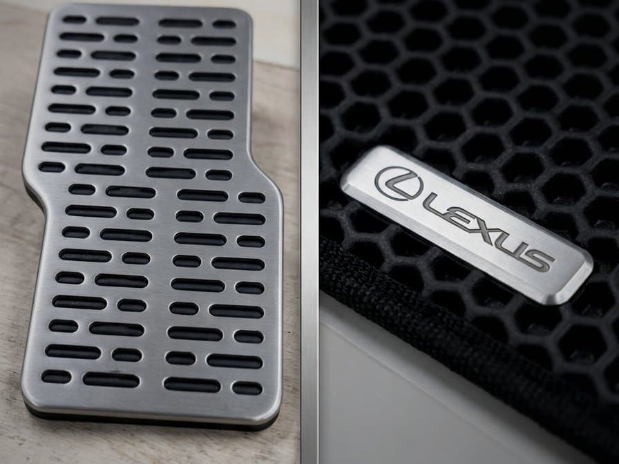 Aluminum heel pad and a metal brand logo plate on a black EVA mat